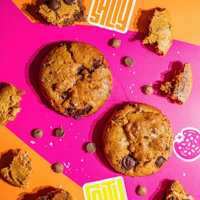 This is our (C)lean Cookie. It's a great example of how less can be more, made with just tahini, almond flour, jaggery, and 54% couverture chocolate buttons.