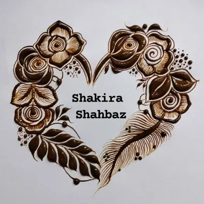 A beautiful heart-shaped floral design, personalized with the names 'Shakira' and 'Shahbaz'. This is a romantic way to celebrate a partnership.