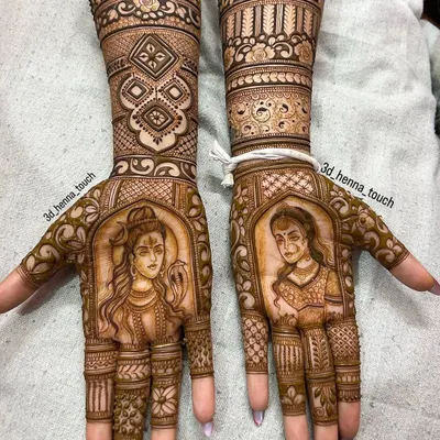 A divine portrait design featuring Lord Shiva and Goddess Parvati on opposite palms. This is a beautiful way to incorporate spiritual elements into your bridal mehndi.