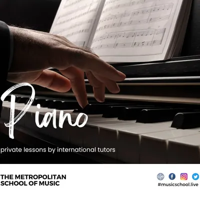 Our piano program features private lessons with international tutors. This close-up shows the focus on proper hand posture and technique while reading sheet music, which is essential for classical piano training.
