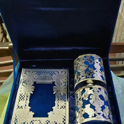An opulent boxed wedding invitation set designed for a lasting impression. The combination of royal blue velvet, intricate silver laser-cutting, and matching gifts makes this more than an invite; it's the first chapter of your wedding story.