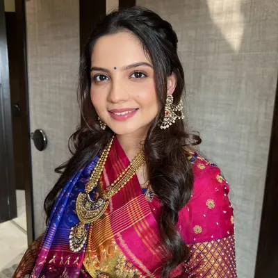 This mom-to-be was radiant for her Godh Bharai ceremony. Her minimal, dewy base created the perfect "no makeup-makeup look," allowing her natural beauty to shine.