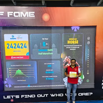 One of our runners at the Vedanta Delhi Half Marathon (VDHM) expo, showing his impressive race history. We are proud of our members' consistency and dedication.