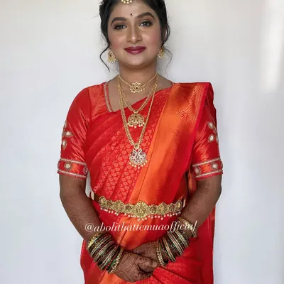 A classic South Indian bridal look. I used warm tones and a bold red lip to complement her beautiful Kanjeevaram saree and traditional temple jewelry.