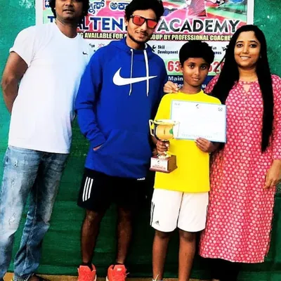 A proud moment for our academy as our champion Likhith celebrates his tournament win with his parents and me. We host in-house tournaments to give our players valuable match experience.