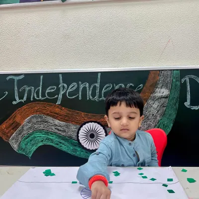 A young patriot carefully creates the Indian flag using paper collage. This Independence Day activity helps develop fine motor skills while teaching about our national symbols.
