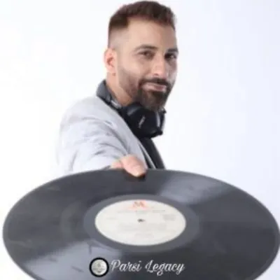 Holding a classic vinyl record. My love for music goes way back, from old-school records to today's digital beats. This deep appreciation for all genres of music is what allows me to be an open-format DJ who can cater to any crowd.