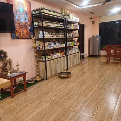 A view of our clinic's interior, showing the calm ambiance and our extensive in-house pharmacy. We stock a wide range of pure, authentic Ayurvedic herbal products to support your treatment plan.