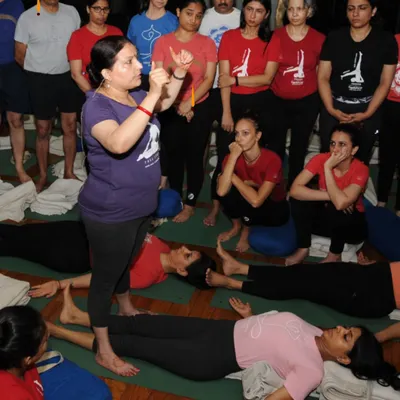 A moment of instruction during a class. I believe in guiding my students with clarity and precision, helping them move from self-doubt to self-trust both on and off the mat.