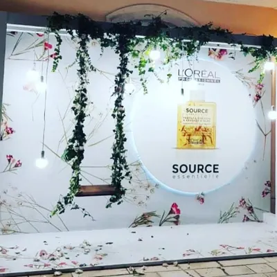This fully custom backdrop for L'Oréal features product branding, a physical swing, and thematic lighting. We specialize in creating these immersive brand activations that encourage guest interaction and social sharing.