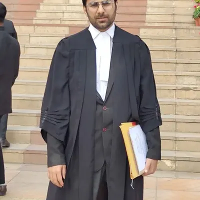 A formal portrait in my advocate's gown on the court steps. This uniform represents my progress and dedication to the legal profession.