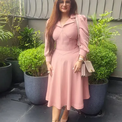 Pink is more than just a pretty color; it is powerful. This structured blush pink dress embodies grace and confidence, making it perfect for both a professional meeting and a social brunch. The right shade of pink can soften your look while asserting your presence.