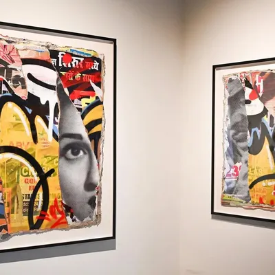 Two of my décollage pieces exhibited in a gallery setting. Seeing them framed and on a clean wall highlights the contrast between their street origins and their status as fine art.