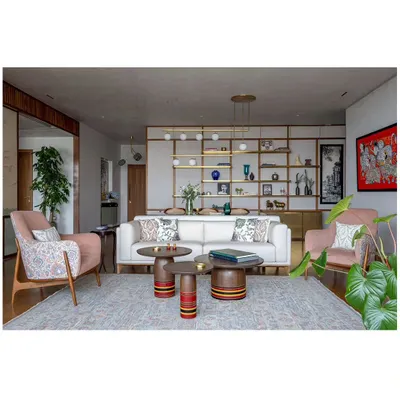 The main living area of Ikigai House, showing the interplay of different seating arrangements, custom furniture, and art. The space is designed for both large gatherings and quiet family moments.