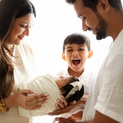 The pure excitement of a big brother welcoming his baby sister. I aim to capture the real emotions of your family's story, creating authentic portraits filled with love and personality.