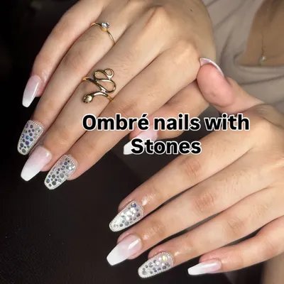 A stunning choice for the modern bride. This set features a soft white ombré fade on long coffin nails, with accent nails fully covered in sparkling silver stones for maximum glamour.