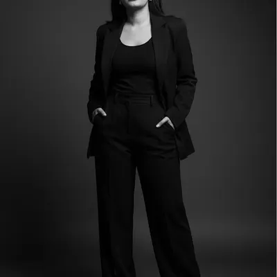 This black and white portrait captures my dual nature: a gentle soul with a warrior spirit. It is this balance that I bring to my practice, offering both empathetic counsel and fierce representation in cyber law cases.