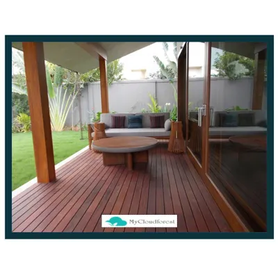 This project features a beautiful Ipe wood deck that creates a warm and inviting patio area. This durable hardwood is an excellent choice for outdoor flooring, providing a long-lasting and elegant foundation for outdoor living.