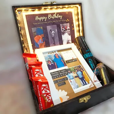 A look inside my "Black Vintage Hamper for Him." This light-up box includes a custom photo collage, deodorant, chocolates, and a message in a bottle, making it a complete birthday package.