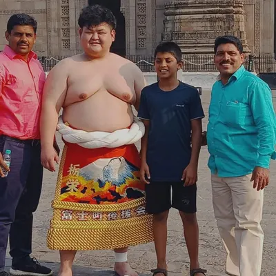 Wrestling connects cultures. Our coach Sandip Dalvi with a Japanese sumo wrestler at the Gateway of India during a Maharashtra and Japan wrestling meet, fostering international sportsmanship.