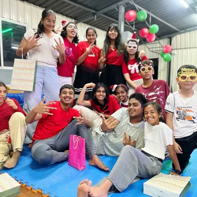 The whole crew together for a Christmas celebration. We believe in creating a strong community, and our parties are all about fun, friendship, and making memories.