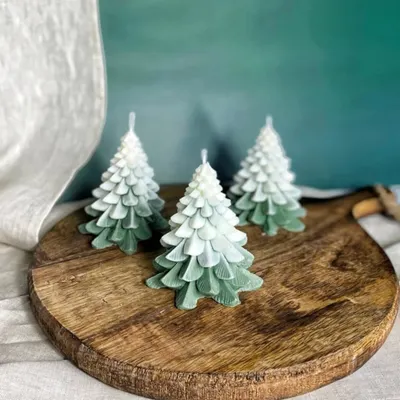 My ombre green Christmas tree candles are a beautiful addition to any holiday decor. They are hand-poured with soy wax and look stunning on a wooden board.