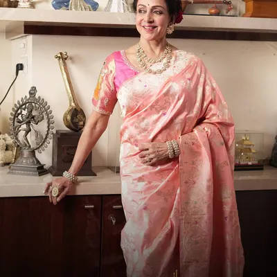 The legendary Hema Malini, an icon of timeless grace, wearing a classic polki diamond necklace and bangle set. A true honor to adorn a star of her legacy.