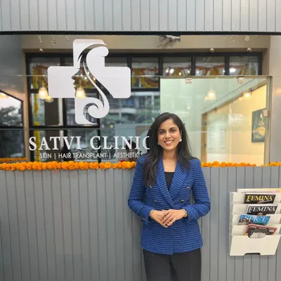A professional portrait of me at my clinic. I am dedicated to being an accessible and knowledgeable resource for my patients, providing expert guidance for all skin and hair concerns.