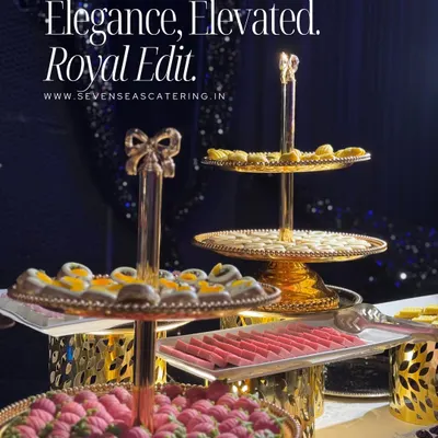 Elegance, Elevated. The Royal Edit. Why just serve sweets when you can serve a spectacle? Our tiered golden stands present a dazzling array of Indian mithai and pastries.