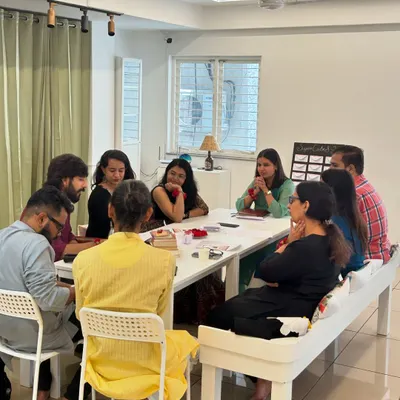 A "Guftugu" literature gathering in session. Our space is perfect for intimate discussions and creative brainstorming around a table.