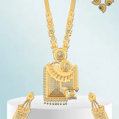 Designed to enchant, this long gold necklace set features a large, geometric pendant and matching earrings. The intricate machine-cut detailing makes it a modern luxury piece that is built to last.