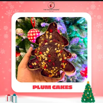 The holiday season isn't complete without the taste of a classic plum cake. Our Christmas tree-shaped plum cake, rich with fruits and nuts, is a festive favorite that brings the magic of the season to your dessert table.