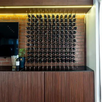 This is our 'Boutique de la Reserve', where you can purchase our wines. The design combines rustic brick cladding with a refined wooden ribbed counter and an exquisite wine display, creating a memorable shopping experience.