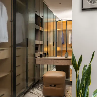 This is the ultimate walk-in wardrobe wonderland, nestled in a sprawling 4300 sq. ft. Mumbai paradise. I designed it with boutique-style shelving, ample mirrors, and a dedicated dressing table to make getting ready a true runway experience.