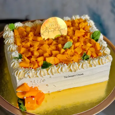 My seasonal bestseller, the Mango Maharaja cake. This square cake is loaded with fresh, juicy Alphonso mango chunks, making it the ultimate summer treat.