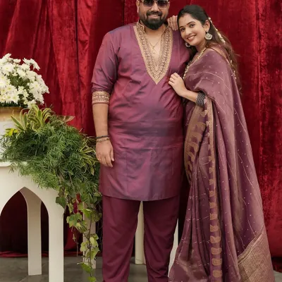A beautiful portrait of director Tharun Sudhir and actress Sonal Monteiro. I designed his custom kurta in a deep wine color with intricate gold embroidery around the neck, perfectly complementing her matching saree for a coordinated, elegant look.