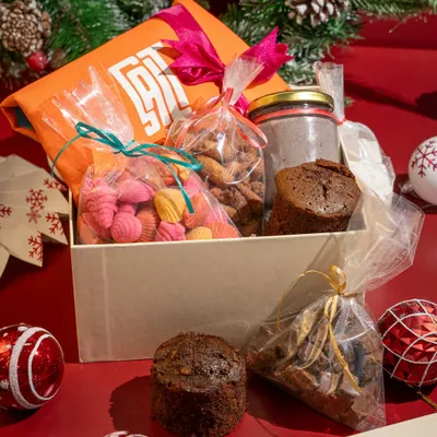 This is the Big Christmas Hamper, for when you're feeling extra generous. It includes two boozy cakes, larger portions of all the treats, a DIY hot chocolate kit, and a sassy tote bag.