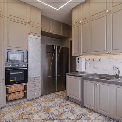 This kitchen is a bohemian oasis, where the functionality of a modular design meets creative charm. The sage green routed shutters and intricate floor tiles work together to create a space of serenity and inspiration.