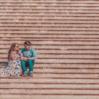 Using the architectural lines of these steps to frame a quiet moment. This wide shot shows how we can turn any location into a beautiful backdrop for your pre-wedding photoshoot.