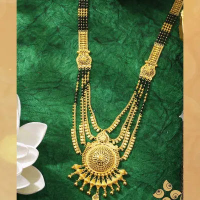 A classic multi-string gold mangalsutra with a large, circular pendant. This timeless design is a staple for any jewellery retailer, and we ensure consistent availability.