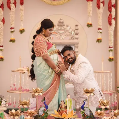 A heartwarming moment from a client's baby shower (seemantha). The couple looks so happy, and her pastel saree is the perfect choice for this beautiful occasion.