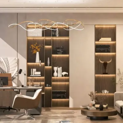 This modern executive office uses a combination of natural light and layered artificial lighting to create a bright, inspiring workspace. The custom built-in shelving and minimalist desk maintain a clutter-free environment, essential for a high-level executive.