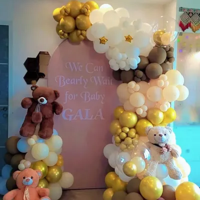 Our "We Can Bearly Wait" theme is a client favorite for baby showers. This setup features a custom arched backdrop, an organic balloon garland, and multiple teddy bears, creating a sweet and memorable scene.