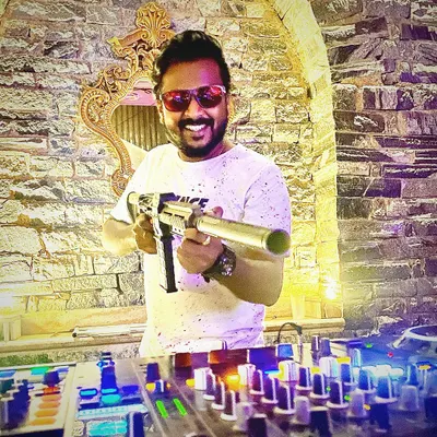 Firing up the dance floor with beats since 2006. This shot captures the fun and interactive elements I bring to my sets, using props and shout-outs to make the party more engaging.