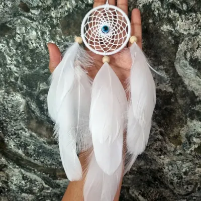 Minimalist vibes, maximum charm. This small white evil eye dreamcatcher is the perfect piece of art for your car, customized with love for our client.