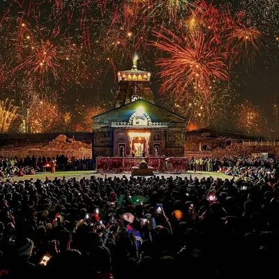 The Kedarnath Temple illuminated by a spectacular fireworks display. This shot captures a moment of divine celebration, blending the ancient temple's spiritual energy with a burst of modern festivity.