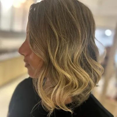 This is the ultimate beach blonde hair. I created this bright, dimensional blonde balayage and styled it with beach waves for a perfect summer look.