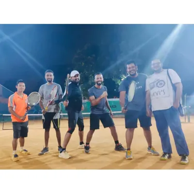 A group of friends enjoying their time on the court after a great session. This is what it's all about: enjoying the sport and the company.