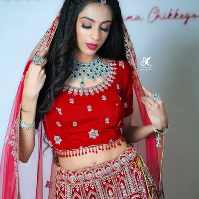 A look from my Airbrush Makeup Masterclass. This classic North Indian bridal look features a red velvet lehenga, which I have paired with a soft smokey eye and a bold red lip for a timeless result.