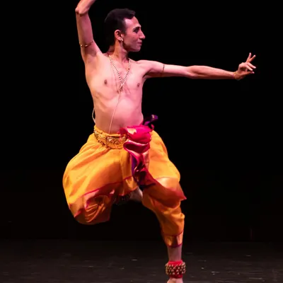 A moment of dynamic energy during a solo recital. This pose, captured mid-movement, reflects the powerful Nritta that forms the backbone of my performances, showcasing the athletic and graceful aspects of Bharatanatyam.